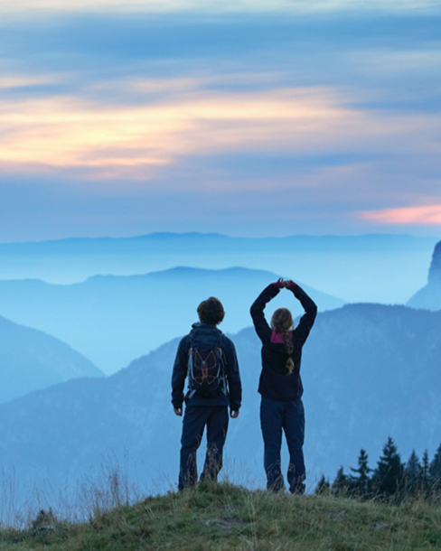 two people on a background of mountains