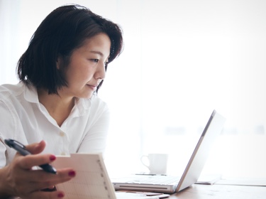 Woman looking at computer