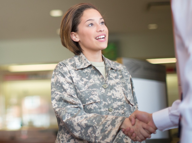 Woman in uniform shaking hand
