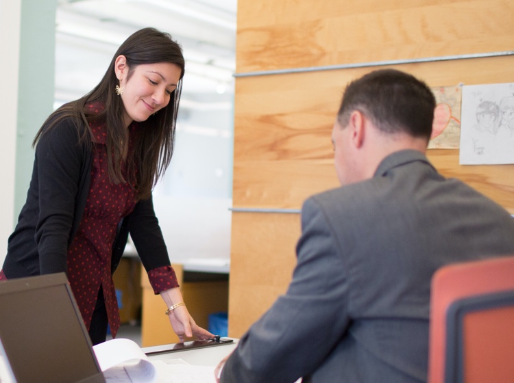 Woman and man in conference room