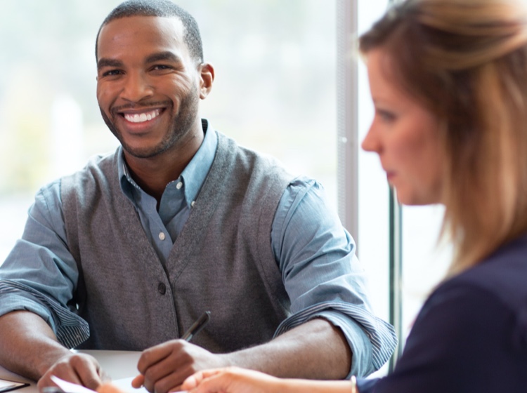 Man smiling in meeting