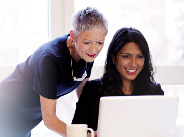 Two women with laptop
