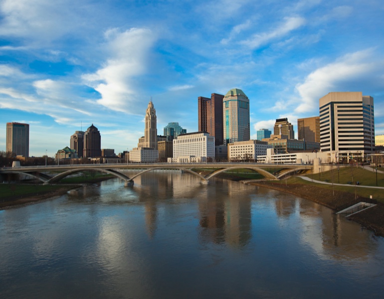 Skyline view with buildings and a bridge over a river