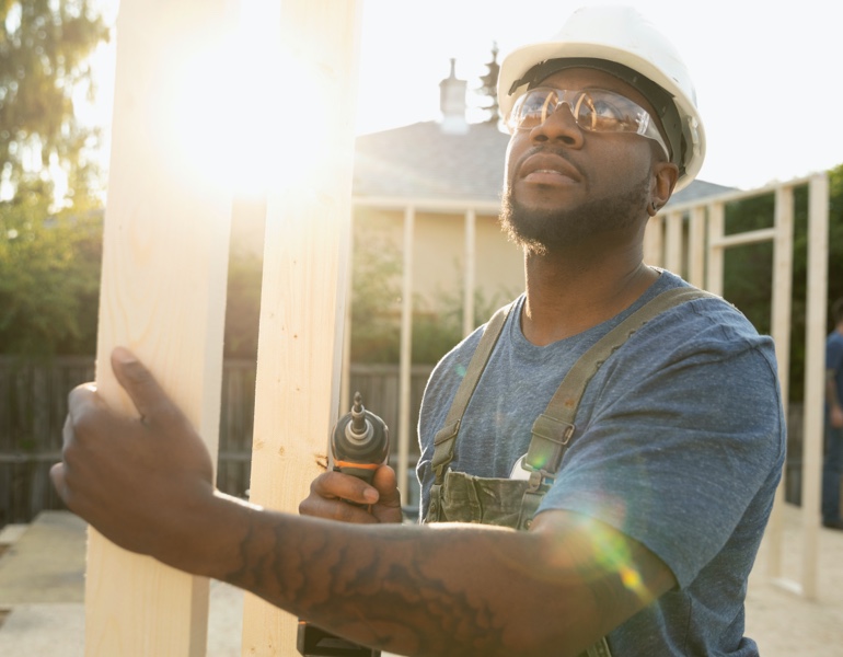 Construction worker with drill