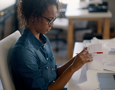 Woman checking paper