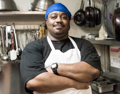 african american chef smiling