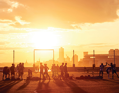 People playing in sunset