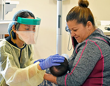 Nurse checking baby