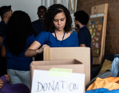 Volunteer organizing donations