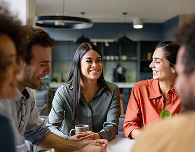 Woman smiling at a group of people