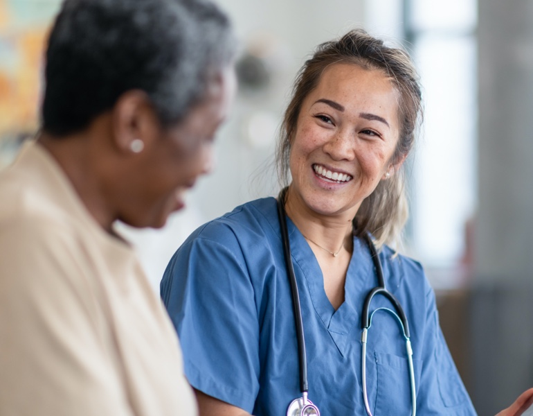 Nurse smiling to a patient
