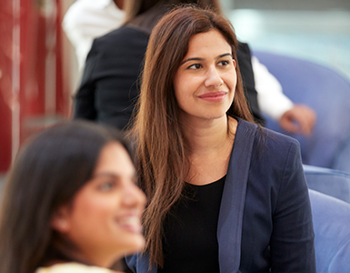 women smiling at the camera