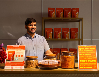 Kartik Das, small business owner of Doosra, displaying samples of his treats.