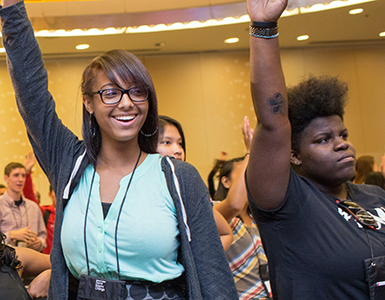 Students raising hands