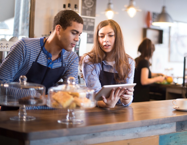 Coffee shop bar with 3 employees working